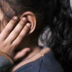 Young slim woman enjoys weight loss result